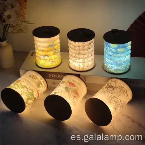 Luz nocturna elegante con diseño de libros plegables